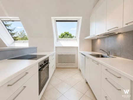 Exklusive 5-Zimmer-Dachgeschosswohnung mit Balkon & Garagenplatz