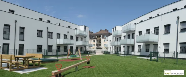 Ab 01.08.2026 verfügbar - 2 Zimmer Balkon Wohnung inkl. EWE Einbauküche direkt in Spillern - Neubau Bj. 2019 - Titelbild