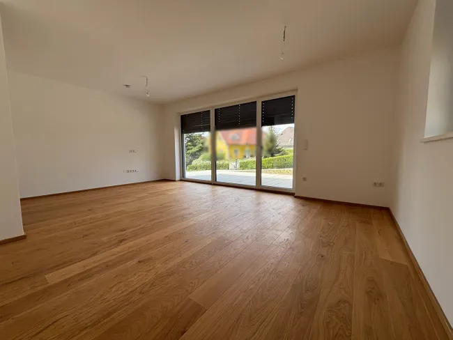 Moderne Erstbezugswohnung mit Garten & Doppelcarport! - Bild