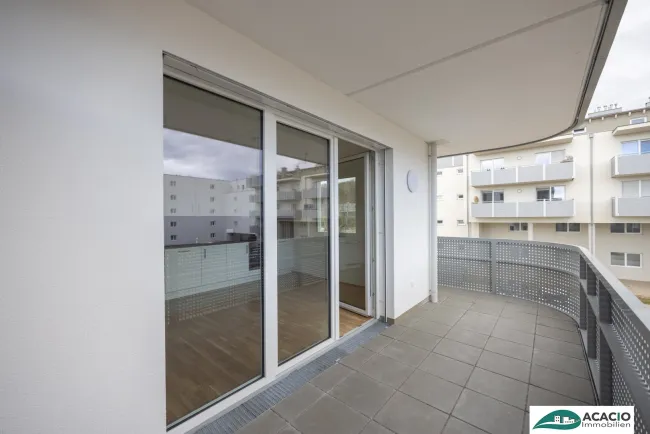 3-Zimmer Wohnung mit Tageslicht-Bad und Eck-Balkon zum Wohlfühlen! Leben im Grünen, aber nahe der Stadt! Tiefgaragenplatz optional verfügbar! - Titelbild
