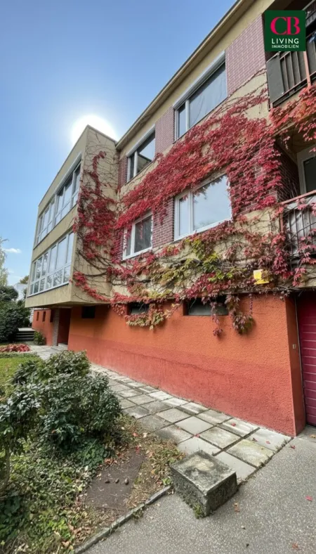 Wohnung mit Balkon, Gartenanteil und Garage - Bild