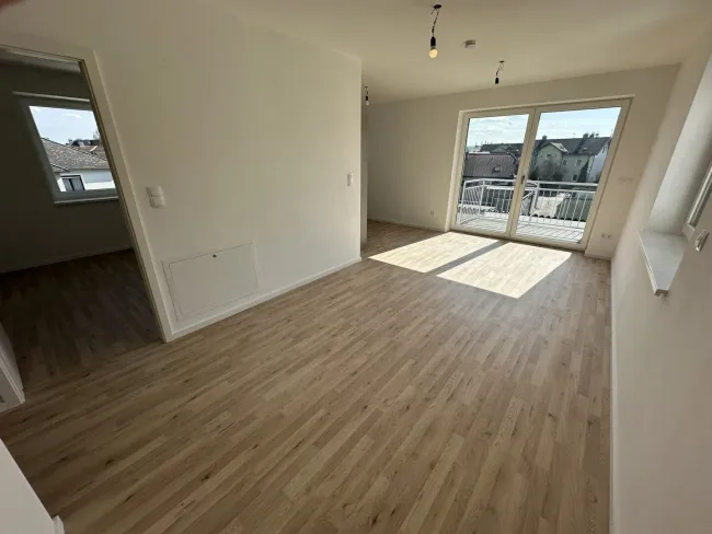Neubau: Stilvolle Wohnung mit Balkon, Wärmepumpe & Lift - Erstbezug! - Titelbild