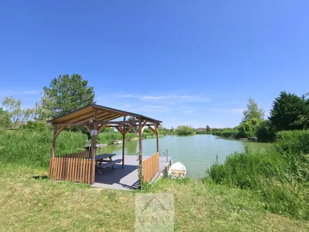 Holzhaus mit Garten & Seezugang – Wohnen, wo andere Urlaub machen!