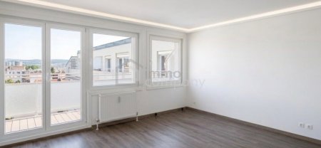 Vollsanierte 4-Zimmer-Wohnung mit 27 qm Südwest-Terrasse nahe Wienerberg City
