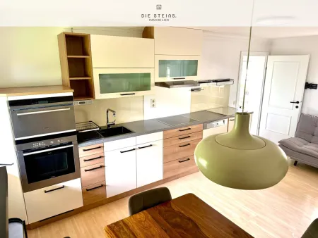 Alpen-Retreat am Tennengebirge: Exklusive 2-Zimmer-Gartenwohnung mit Balkon & allg. Stellplätzen – attraktiv für Eigennutzung, Anleger und touristische Vermietung in St. Martin.