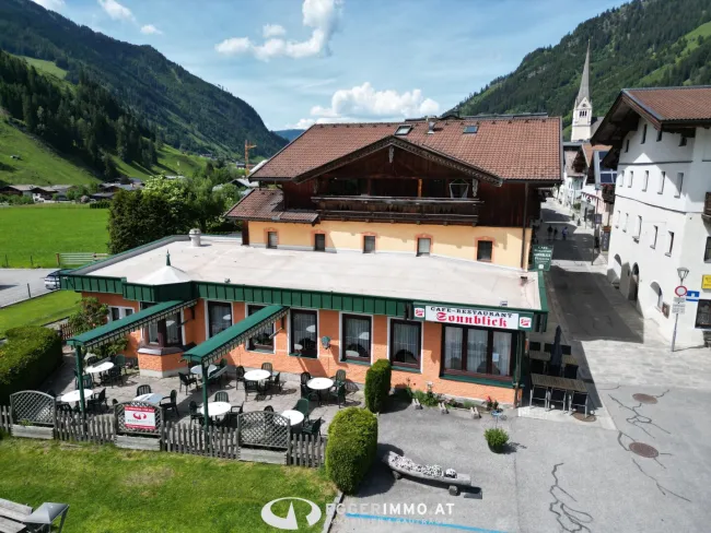 Mehrfamilienhaus mit ausgezeichnetem Restaurant in absoluter Bestlage von Rauris - Titelbild