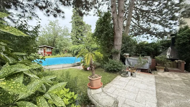 Charmantes Einfamilienhaus mit Pool, Gartenidylle und Entwicklungspotenzial in Bestlage von Wien-Mauer | ZELLMANN IMMOBILIEN - Titelbild