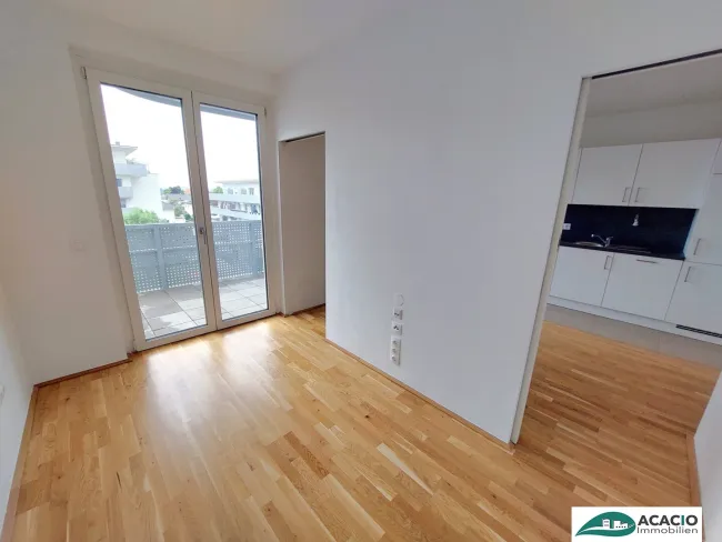 Top-Singlewohnung mit großem Balkon - Leben im Grünen, aber nahe der Stadt! Tiefgaragenplatz optional verfügbar! - Titelbild