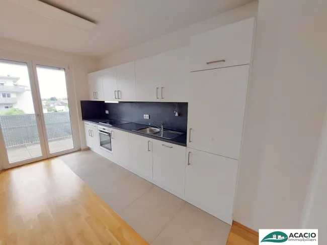 Top-Singlewohnung mit großem Balkon - Leben im Grünen, aber nahe der Stadt! Tiefgaragenplatz optional verfügbar! - Bild