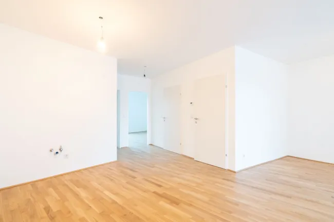 PROVISIONSFREI – Top-Erstbezug in Wels: Stilvolle Wohnung mit Balkon und Tiefgarage zu kaufen! - Bild