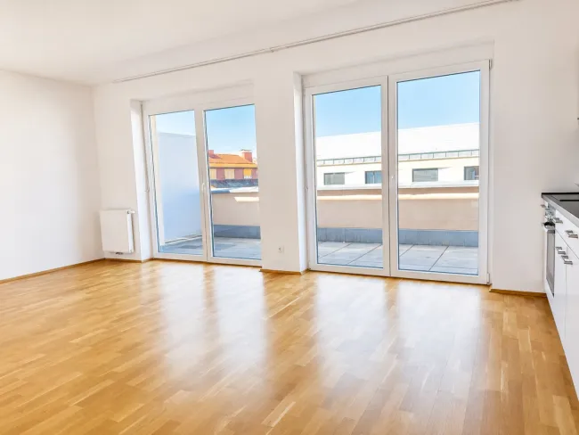 EINMALIGE Penthousewohnung mit 3 Zimmern, 50m2 Dachterrasse und Tiefgarage - Bild