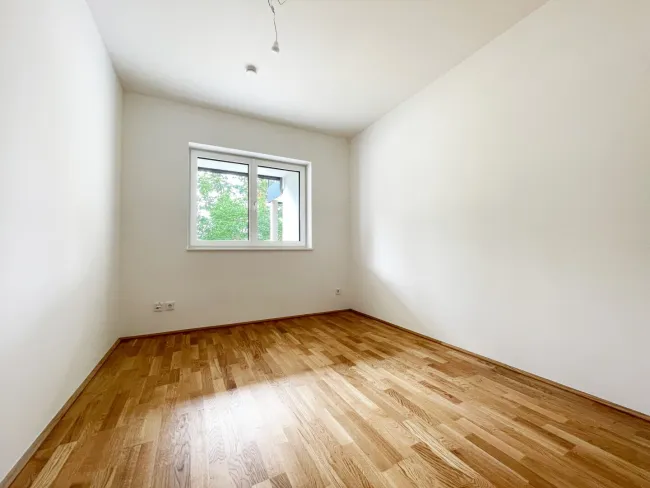 Neubau 2-Zimmer Gartenwohnung mit 128 m² Eigengarten / Loggia / Carport und KFZ-Abstellplatz in Ried im Innkreis (Top 2) - Bild