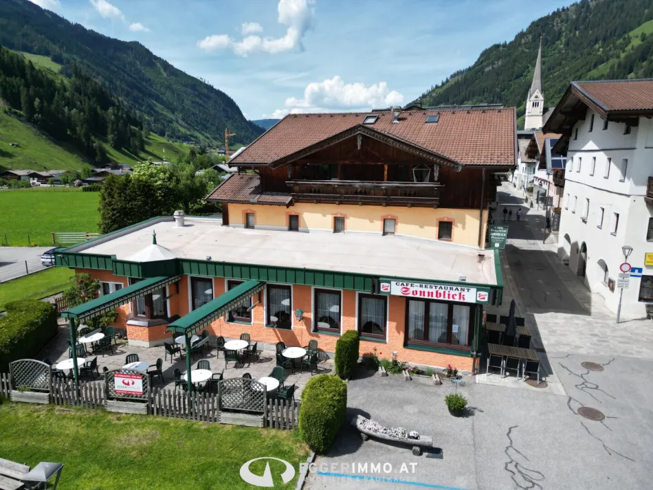 Mehrfamilienhaus mit ausgezeichnetem Restaurant in absoluter Bestlage von Rauris - Titelbild