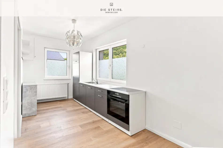 2-Zimmer-Wohnung mit Grünblick - Modernisiert, sofort bezugsbereit - Bild