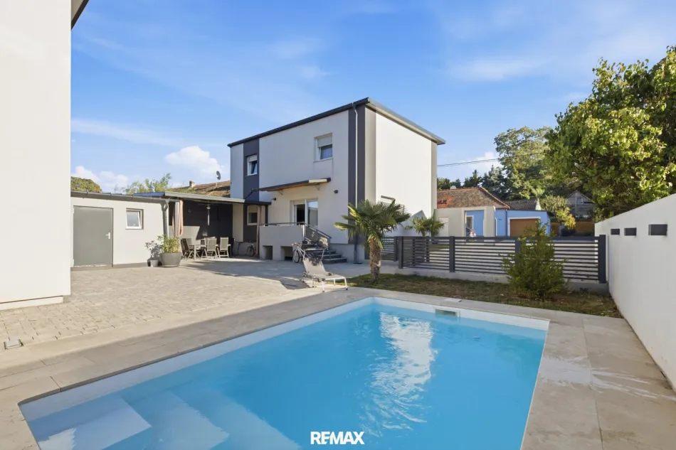 Urlaub zu Hause: Modernes Generationenhaus mit Pool & Palmen-Oase in Aspersdorf! Ideal für Familie, Beruf & Entspannung - Bild