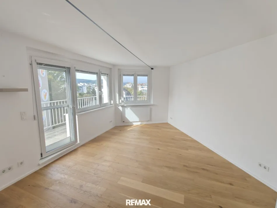 stylische 55m² Dachgeschosswohnung | 2 Zimmer | 23m² Terrasse mit Süd-West Blick | Klimaanlage & Außenjalousien - Bild