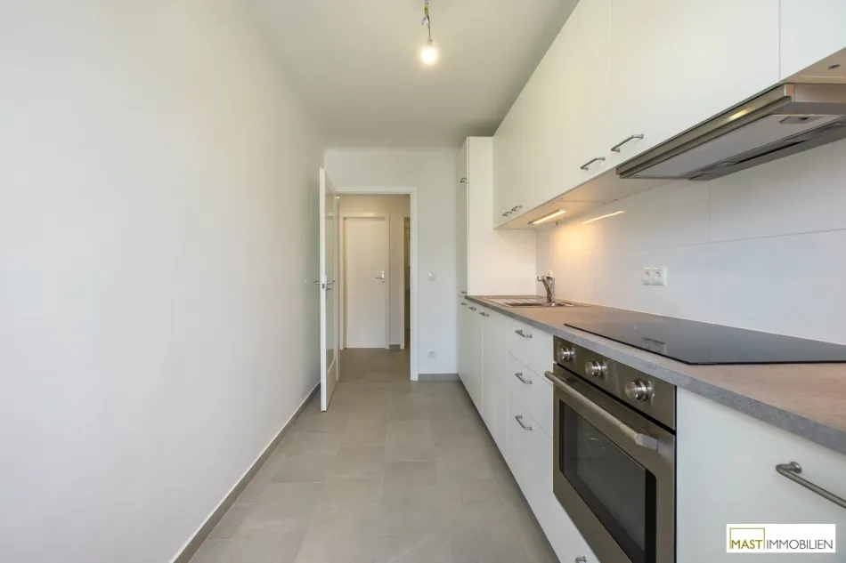 Moderne 2 Zimmer Wohnung mit hochwertiger Einbauküche und zwei Balkonen in zentraler Lage des 15. Bezirks - Titelbild