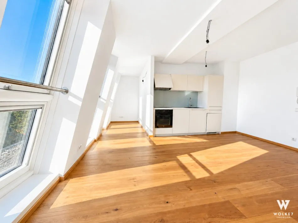 Hochwertig ausgestattete Dachgeschoßwohnung mit Südbalkon in Ruhelage: Blick ins Grüne | U1-Nähe | Klimaanlage | Top Zustand - Bild