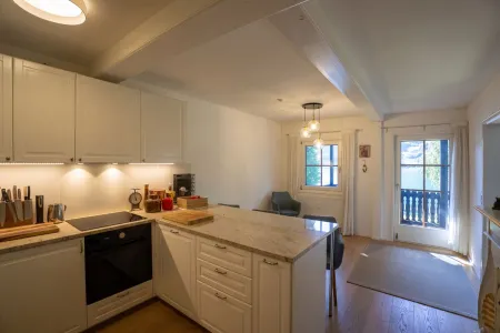 Wohnküche mit Ausgang auf den Südbalkon