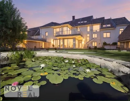 Wohnen wie im eigenen Haus - Exklusive Maisonettewohnung mit Garten in Top Lage - Titelbild