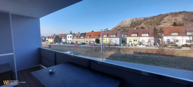 NEUBAU ~60m² + 13m2 Loggia + Garage + Blick auf den Braunsberg - Titelbild