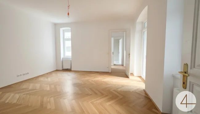 Wunderschön sanierte Altbauwohnung im 1. Liftstock mit ruhigem Balkon - Titelbild