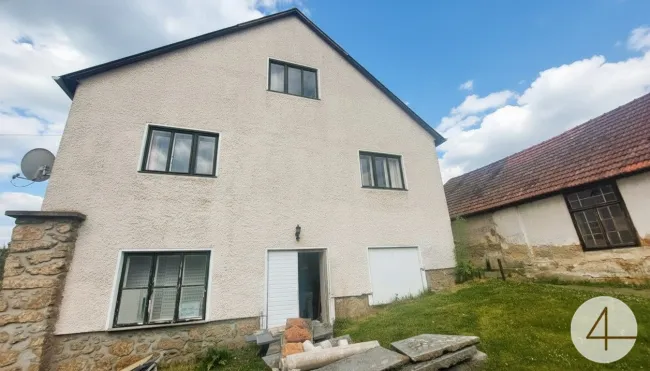 Einfamilienhaus mit Werkstatt - Bild