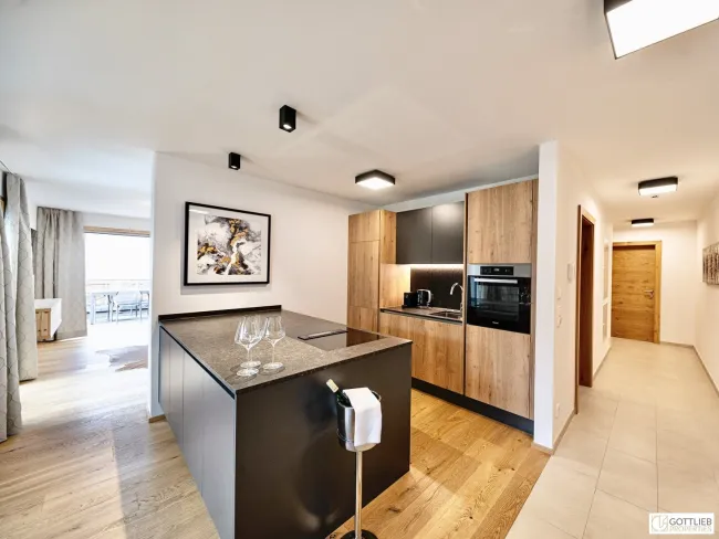 Bestlage Pinzgau mit ca. 6% Rendite! 3-Zimmer-Wohnung mit Südterrasse sowie beheiztem Aussenpool - Bild