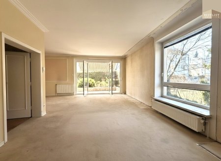 4-Zimmer-Terrassenwohnung mit ca.100m² Garten und TG Stellplatz