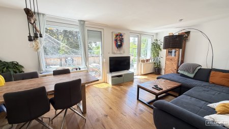 Mauer "Licht. Ruhe. Effizienz. Stilvolle Maisonette mit Südterrasse" | ZELLMANN IMMOBILIEN