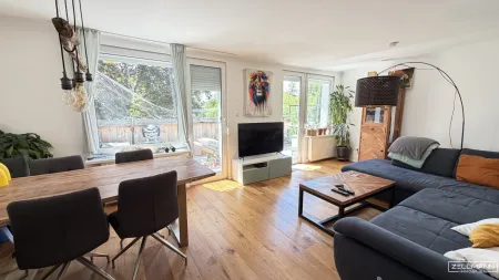 Mauer "Licht. Ruhe. Effizienz. Stilvolle Maisonette mit Südterrasse" | ZELLMANN IMMOBILIEN