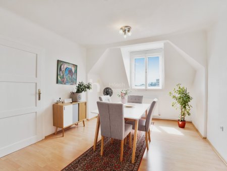 Dachgeschosswohnung mit 3-Zimmer-Potenzial in gepflegtem Altbau